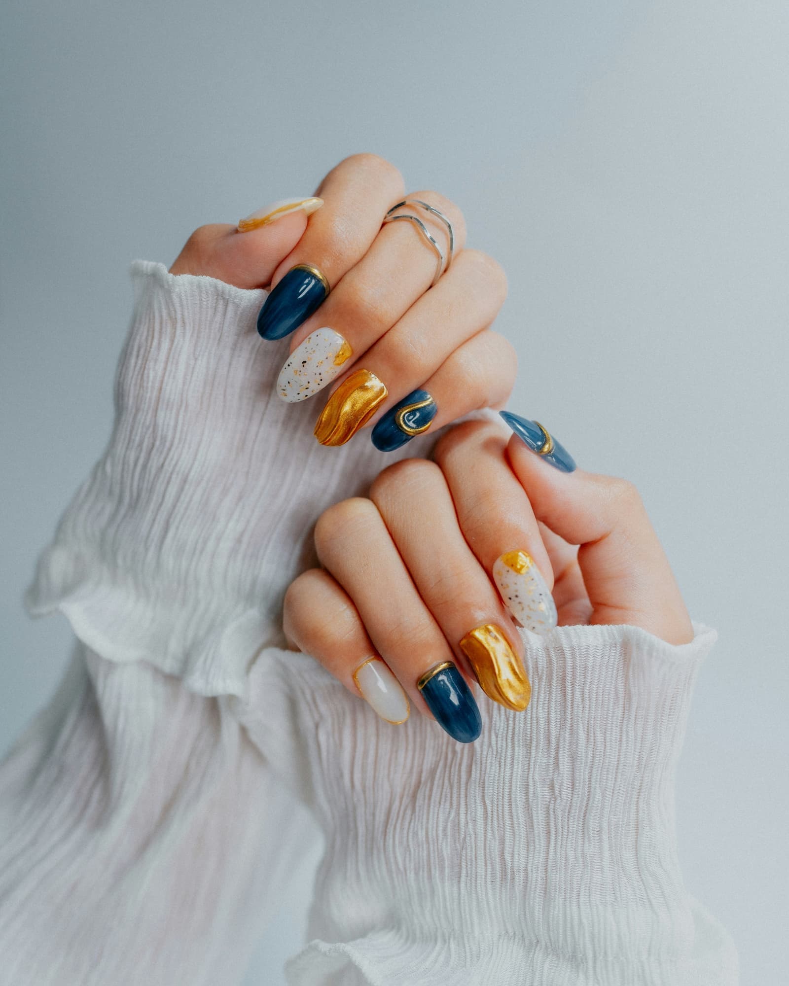Nail technician applying gel polish